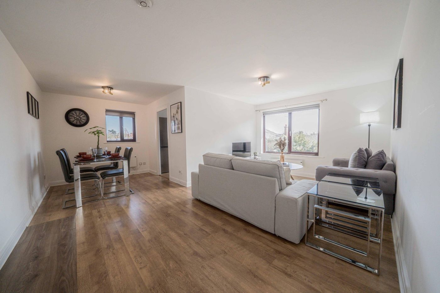 Open-plan living and dining room in a managed two-bedroom apartment in Cobham